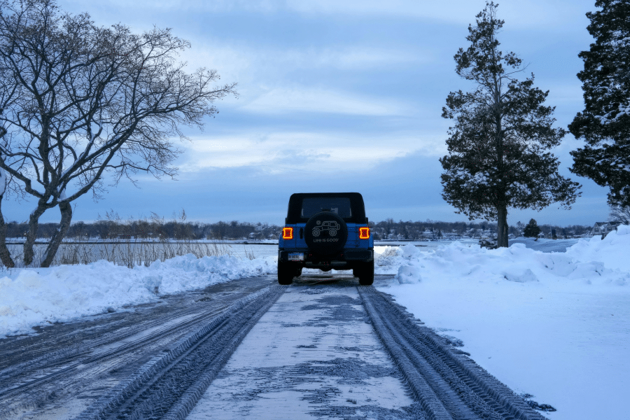 SUV driving in snowy road
